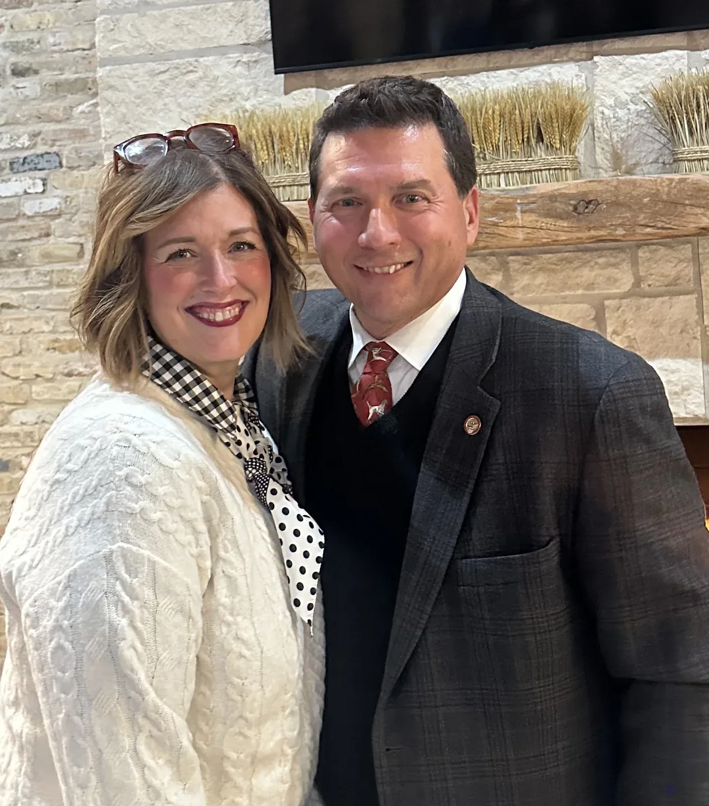 Lee Yancey with his wife Courtney, smiling at home